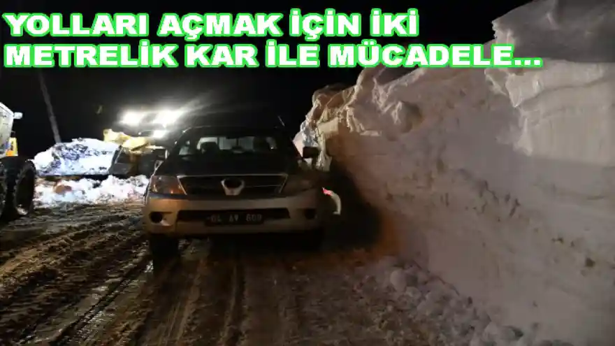 YOLLARI AÇMAK İÇİN İKİ METRELİK KAR İLE MÜCADELE...